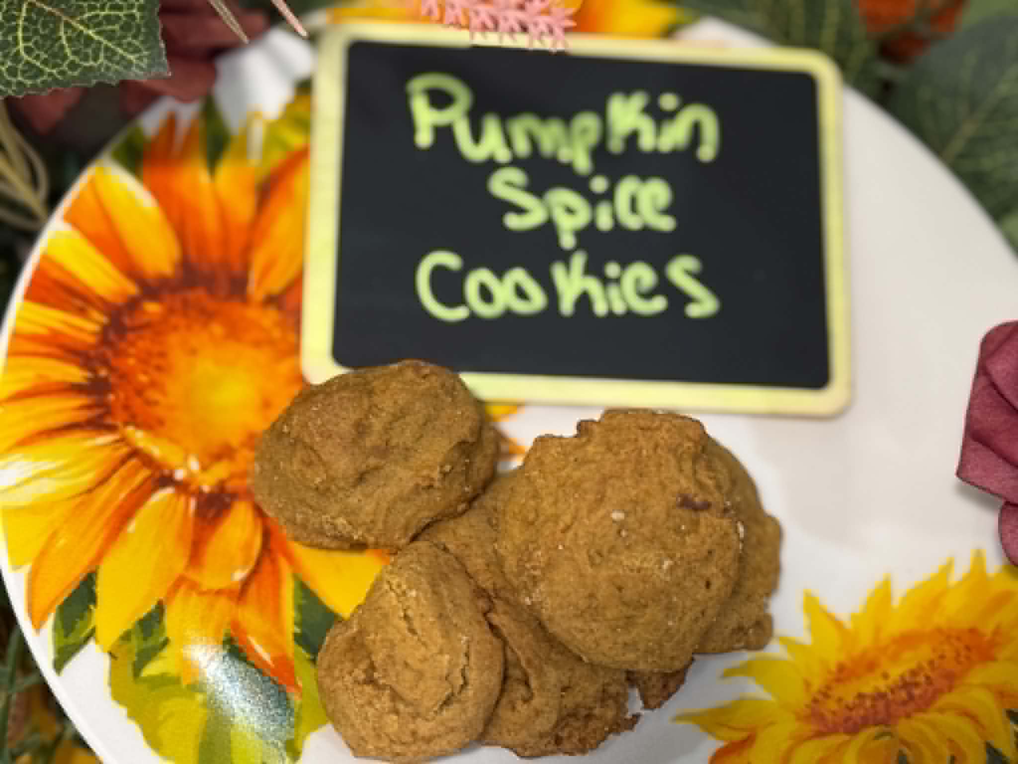 Pumpkin spice cookies on a hand-painted sunflower plate